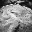 Oblique aerial view centred on the remains of farmstead and rig, taken from the NE.