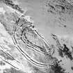 Woden Law, fort and associated monuments: air photograph under snow.
RCAHMS, 1984.
