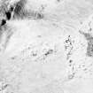 Woden Law, fort and associated monuments: air photograph under snow.
RCAHMS, 1992. (Also shows Dere Street).
