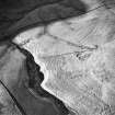 Oblique aerial view centred on the remains of the homestead with rig adjacent, taken from the SE.