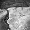 Oblique aerial view centred on the remains of the homestead with rig adjacent, taken from the ESE.