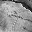 Oblique aerial view centred on the remains of the homestead with rig adjacent, taken from the NNW.