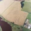 General oblique aerial view centred on the cropmarks of the settlement, taken from the SSW.