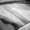 Oblique aerial view centred on the cropmarks of the settlement, the possible fort and possible causewayed enclosure, taken from the E.