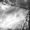 Oblique aerial view centred on the cropmarks of the enclosure, taken from the SW.