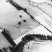 Wooden House, oblique aerial view, taken from the ENE, centred on the cropmarks of a fort. The NE angle of the Wooden Home Farm Roman temporary camp is visible in the centre right of the photograph.