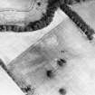 Wooden House, oblique aerial view, taken from the W, centred on the cropmarks of a fort adjacent to the NE side of the Wooden Home Farm Roman temporary camp.