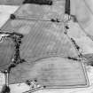 Oblique aerial view centred on the cropmarks of the settlement, taken from the ENE.