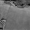 Oblique aerial view of Thornton Law centred on the cropmark of an enclosure.  Taken from the SSE.