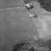 Oblique aerial view of Thornton Law centred on the cropmark of an enclosure.  Taken from the SW.