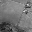 Oblique aerial view of Thornton Law centred on the cropmark of an enclosure.  Taken from the S.