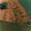 Oblique aerial view centred on the cropmarks of the settlement, taken from the WSW.