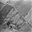 Oblique aerial view centred on the cropmarks of the settlements, taken from the NNE.