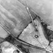 Oblique aerial view centred on the cropmarks of the fort, taken from the ESE.