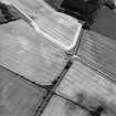 Oblique aerial view centred on the cropmarks of the possible enclosure, taken from the NW.