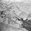 Oblique aerial view centred on the remains of the rig and radar station, taken from the ESE.