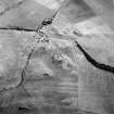 Oblique aerial view centred on the remains and cropmarks of the possible settlement, taken from the NNW.