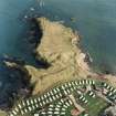 Oblique aerial view centred on the remains of the artillery fortification, taken from  the SW.