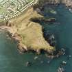 Oblique aerial view centred on the remains of the artillery fortification, taken from  the E.