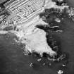 Oblique aerial view centred on the remains of the artillery fortification, taken from  the ENE.