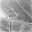 East Reston, oblique aerial view taken from the SSW, centred on the cropmark of a barrow.