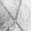 Oblique aerial view centred on the cropmarks of the barrow and ring-ditch, taken from the SE.