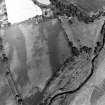 Oblique aerial view centred on the cropmarks of the barrow and unenclosed settlement, taken from the WSW.