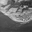 Aerial view of the lighthouse, the church and burial ground, Lochryan House, Glen Cottage military camp, Cairnryan military head quarters and Cairnryan military railway. View taken from the W.