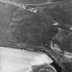 Ballantrae Bridge, Garleffin, oblique aerial view, taken from the SW, centred on the cropmarks of a barrow and four poster stone-circle, and on an area with pits. Two possible souterrains, linear cropmarks, possible enclosures and various other cropmarks are also visible in the photograph.