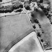 Craigenholly, oblique aerial view, taken from the NE, centred on the cropmarks of a round house and possible souterrain.