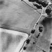 Craigenholly, oblique aerial view, taken from the N, centred on the cropmarks of a round house and possible souterrain.