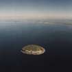 General oblique aerial view looking across Ailsa Craig towards South Ayrshire, taken from the W.