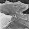 Soulseat Loch-Kirminnoch, oblique aerial view, taken from the N, showing the cropmarks of a roman road and relating quarry pits.