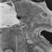 Soulseat Loch-Kirminnoch, oblique aerial view, taken from the NW, showing the cropmarks of a roman road and relating quarry pits.