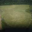 Oblique aerial view centred on the linear cropmarks and the cropmarks of the pit-alignments and pits, taken from the SW.