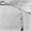 Girvan Mains, oblique aerial view, taken from the N, centred on the cropmark of a fort.