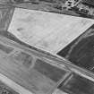 Oblique aerial view centred on the cropmarks of the field boundary, taken from the WSW.