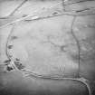 Oblique aerial view centred on the remains of rig, taken from the NNW.