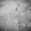 Oblique aerial view centred on the remains of rig, taken from the NE.