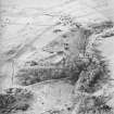 Oblique aerial view centred on the remains of the fort with tank crossing points adjacent, taken from the SE.