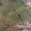 Oblique aerial view centred on the remains of the possible Roman fortlet, taken from the S.