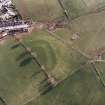 Oblique aerial view centred on the remains of the possible Roman fortlet, taken from the NNE.