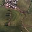 Oblique aerial view centred on the remains of the possible Roman fortlet, taken from the NNW.