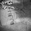 Oblique aerial view centred on the remains of the possible Roman fortlet, taken from the NNW.