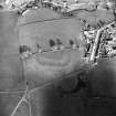Oblique aerial view centred on the remains of the possible Roman fortlet, taken from the WSW.