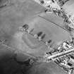 Oblique aerial view centred on the remains of the possible Roman fortlet, taken from the SSW.