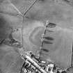 Oblique aerial view centred on the remains of the possible Roman fortlet, taken from the SE.