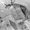 Oblique aerial view centred on the remains of the homestead, taken from the WNW.