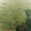 Oblique aerial view centred on the remains of the farmstead, field-system and rig with possible homestead, farmstead, field-system and rig adjacent, taken from the ENE.