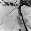 Oblique aerial view of Drumlanrig centred on the cropmarks of a Roman temporary camp with estate cottages, taken from the SE.